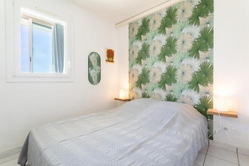 Postel nebo postele na pokoji v ubytování Appartement Canet plage front mer
