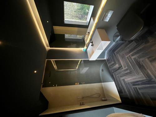an overhead view of a bathroom with stairs and a sink at Luxury Villa in Central Woodstock in Woodstock