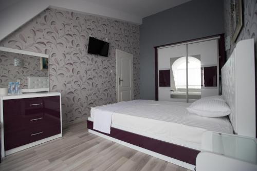 Katil atau katil-katil dalam bilik di Apart Hotel Central