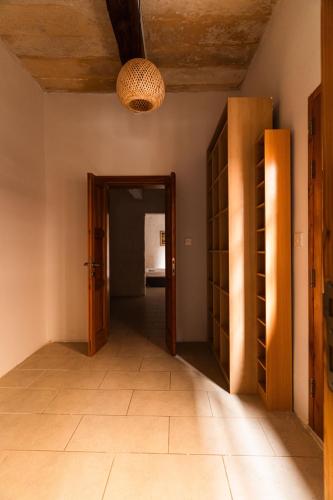 a hallway with a door open to a room at Suite 5 at Palazzo Seraphim Boutique living in St Julians in St Julian's