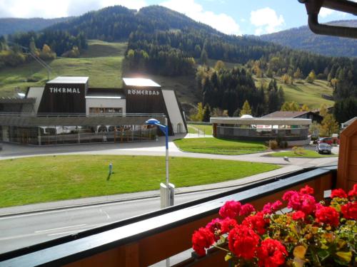 a view from a balcony of a building with a mountain at Haus am Römerbad in Bad Kleinkirchheim