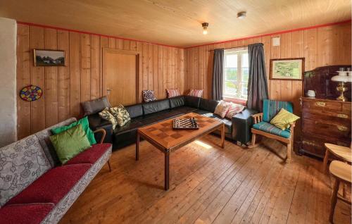 a living room with a couch and a table at 4 Bedroom Gorgeous Home In Ryfoss in Ryfoss