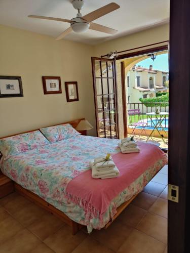 a bedroom with a bed with towels on it at Lluna Beach Bará in Roda de Bará
