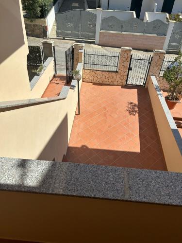 a view of a patio with benches on a building at L'Alba in Tropea