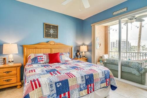 a bedroom with a bed and a large window at Bayfront Punta Gorda Condo Rental with Pool Access! in Burnt Store Marina