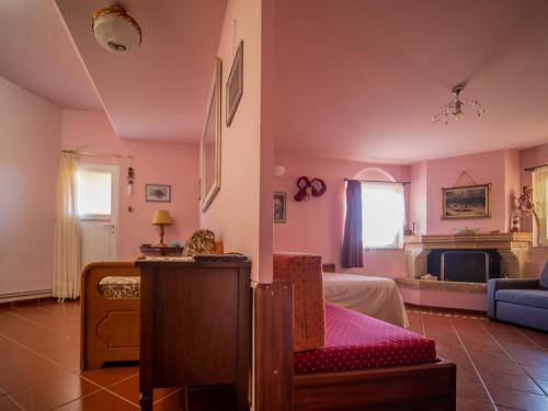 a living room with a bed and a couch at Private Art Studio 50m from sea (1-4 per) in Monemvasia