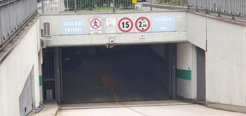 an entrance to a tunnel with signs on it at Casa di Fausto - CityLife Apartment in Milan