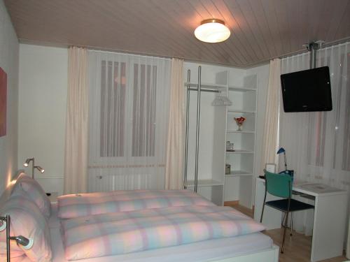 
Ein Bett oder Betten in einem Zimmer der Unterkunft Hotel Sporting
