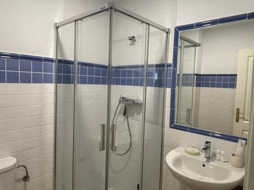 a bathroom with a shower and a sink at Luxury Hacienda Golf Islantilla in Islantilla