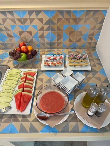 a table with different types of food on it at Chipibeach B&B, Hostal Boutique in Chipiona