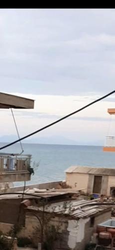 a view of the ocean from a window at Μαρια in Xylokastron