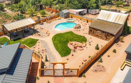 an aerial view of a miniatureestead with a pool and a building at Timber & Tin G 2Bed 2Bath w Pool & Rooftop Deck in Kanab