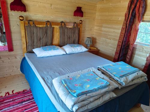 Postel nebo postele na pokoji v ubytování Kalmaküla kämpingud