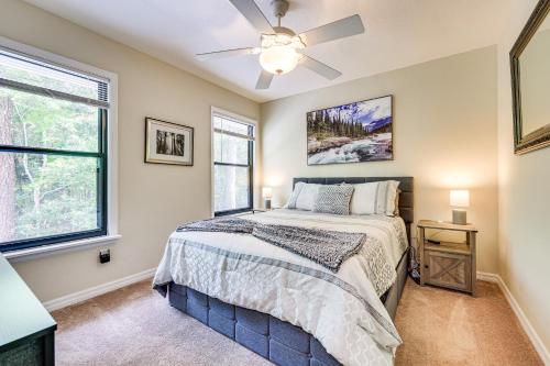 a bedroom with a bed and a ceiling fan at Rural Retreat! Florida Cottage with Screened Patio in Pine Bluff