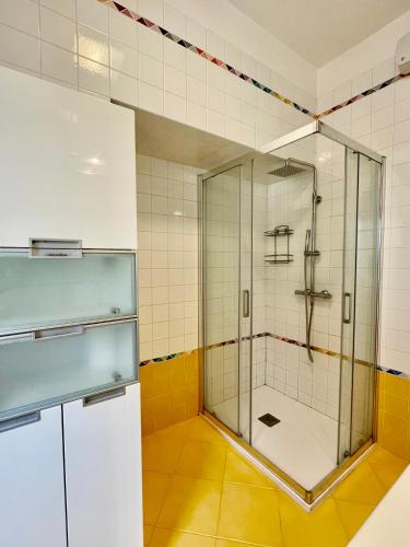 a shower with a glass door in a bathroom at Venice Travel Dream Spacious Apartment near Venice in Mestre