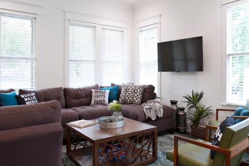 a living room with a couch and a table at NEW Music Icon House in East Nashville in Nashville