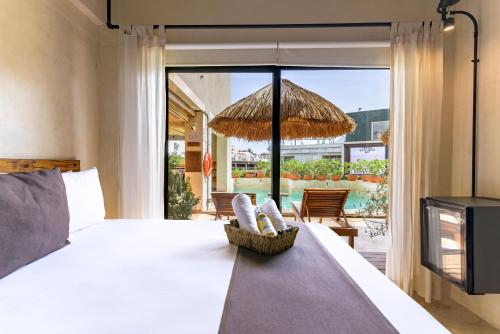 Postel nebo postele na pokoji v ubytování Caribbean Paradise Hotel & Spa - 5th Avenue