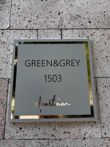 a sign on a wall that reads greenagency at Green and Grey 1503 in Szeged