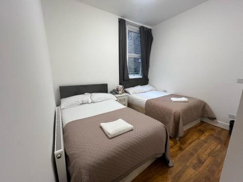 Postel nebo postele na pokoji v ubytování World Hotel