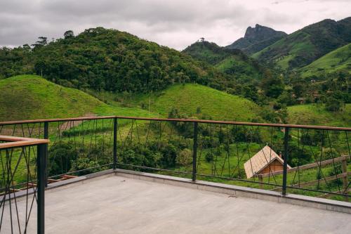 a balcony with a view of a mountain at Chalés La Vista - Visconde de Mauá in Visconde De Maua