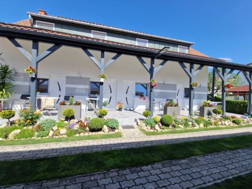 a garden in front of a house at Hajnalka vendégház in Bük