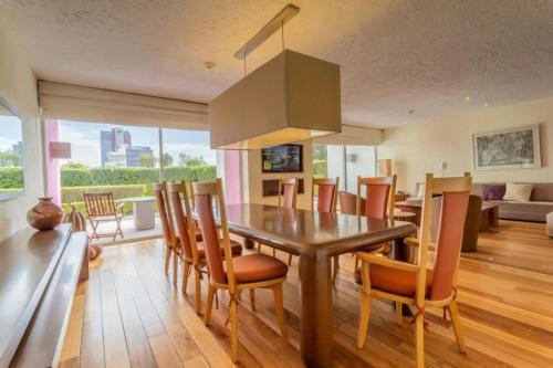 a dining room with a table and chairs at Camino Real Polanco Mexico in Mexico City