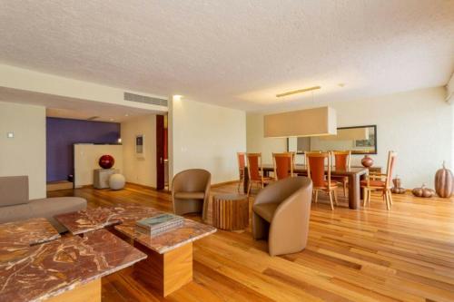 a living room with a couch and a table at Camino Real Polanco Mexico in Mexico City