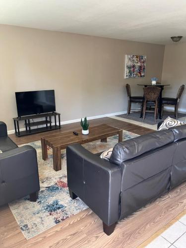 a living room with a couch and a coffee table at Serene 2bed 1bath condo with parking in Fresno