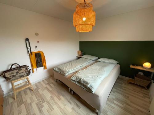 Postel nebo postele na pokoji v ubytování Velkommen til Vibereden