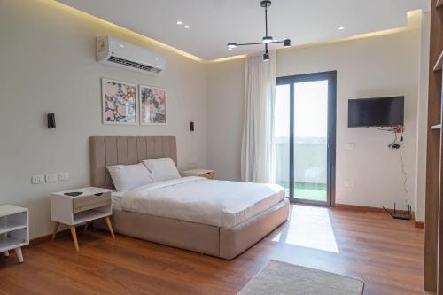 Postel nebo postele na pokoji v ubytování Settle Inn Sodic Villette Apartment