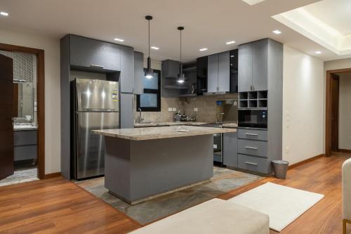 Kuchyň nebo kuchyňský kout v ubytování Settle Inn Sodic Villette Apartment