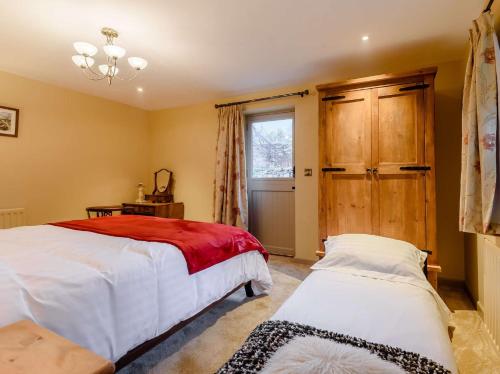 a bedroom with two beds and a window at 1 Bed in Waterfall 89733 in Waterhouses