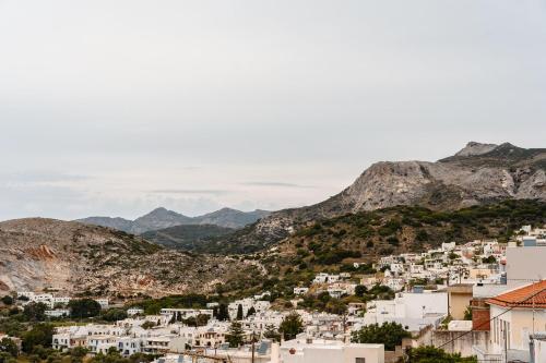 a view of a town with mountains in the background at Feel Filoti in Philotium