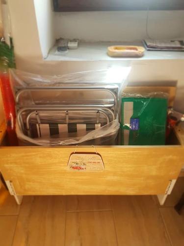 a wooden drawer with two suitcases in it at To Palio Kamini in Velanídhia