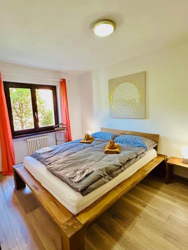 a bedroom with a large bed with two teddy bears on it at Paradise by the Lake Lugano in Brusino Arsizio