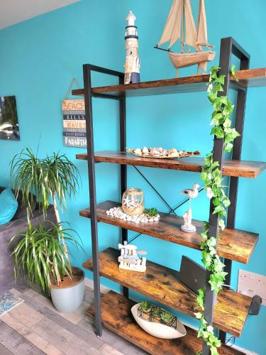 a wooden shelf with a toy boat on it at Seaside beach themed home with garden and driveway in Lytham St Annes