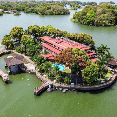 an aerial view of a resort in the water at Hotel El Reith Lake in Granada