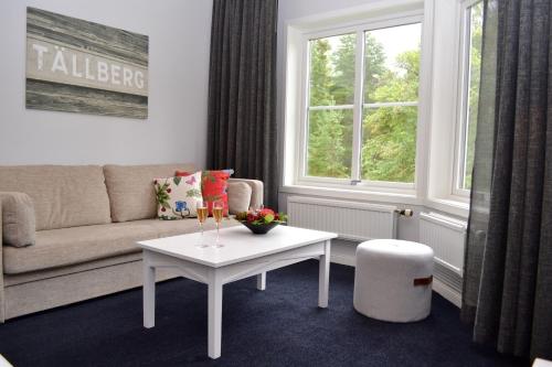 a living room with a couch and a table at Dalecarlia Hotel & Spa, BW Premier Collection in Tällberg