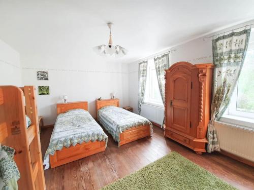 Ένα ή περισσότερα κρεβάτια σε δωμάτιο στο Gite de la Verrière, 12 personnes, 5 chambres