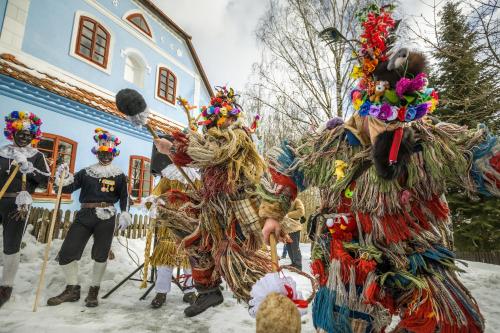 a group of people dressed in costumes in the snow at Apartmán Hamerka in Hlinsko