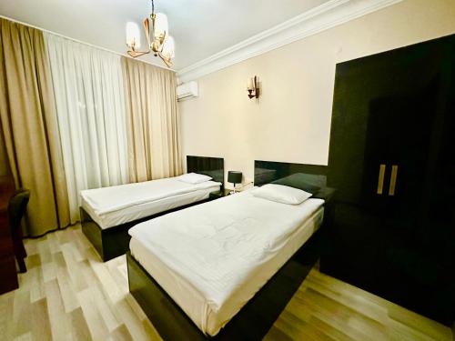 Postel nebo postele na pokoji v ubytování Hotel Tsereteli