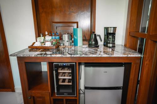 a kitchen with a counter with a coffee maker at Paradise Hot Springs - Thermal Water & Volcano Views in Fortuna
