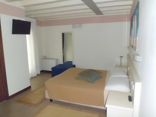 a bedroom with a bed in a room at Sweet Home in Treviso