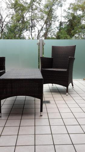 two chairs and a table on a patio at Sweet Home in Treviso