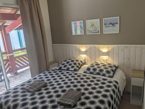 En eller flere senge i et værelse på Appartement LE DAOUN Dunes, Pins Océan et Golf