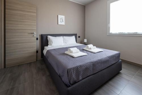 Postel nebo postele na pokoji v ubytování IseoLakeRental - Soleaura