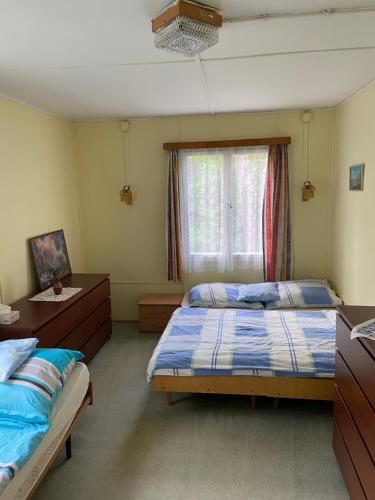 Postel nebo postele na pokoji v ubytování Chata Slapy Skalice 2