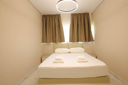 Un ou plusieurs lits dans un hébergement de l'établissement SanPietro Vacation Rentals