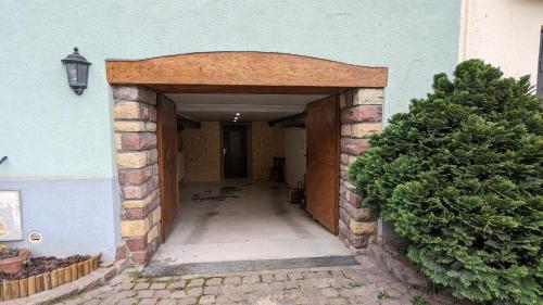 an entrance to a building with a brick archway at Tu casita au centre-ville de Rouffach in Rouffach