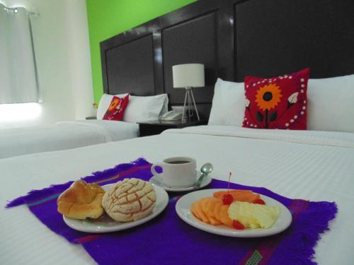 Postel nebo postele na pokoji v ubytování Chiapas Hotel Express, Tuxtla Gutierrez